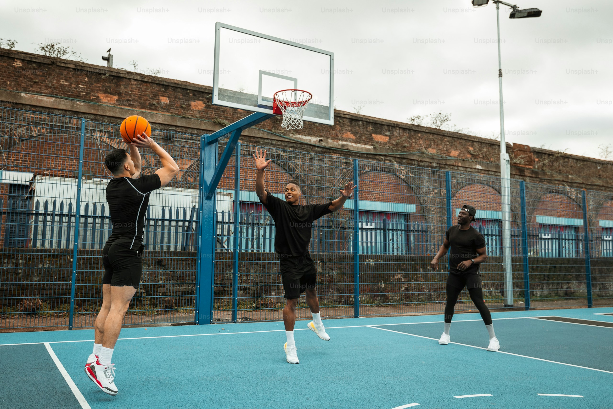 Basketball players on outdoor court