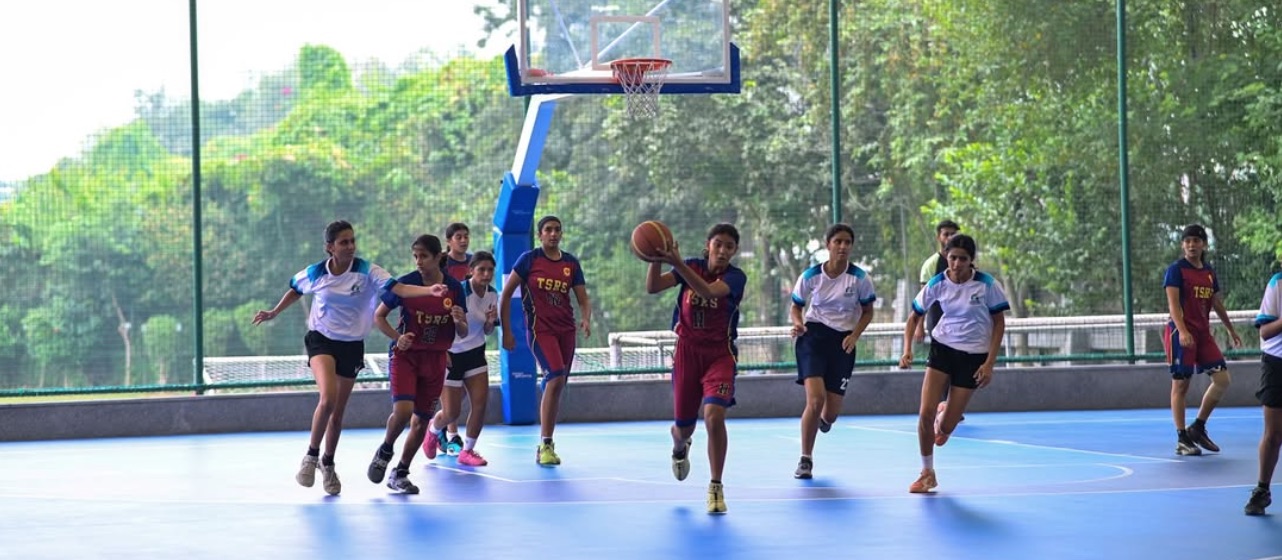 Basketball players on outdoor court